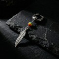 Arete Solitario Pluma y Arcoíris
